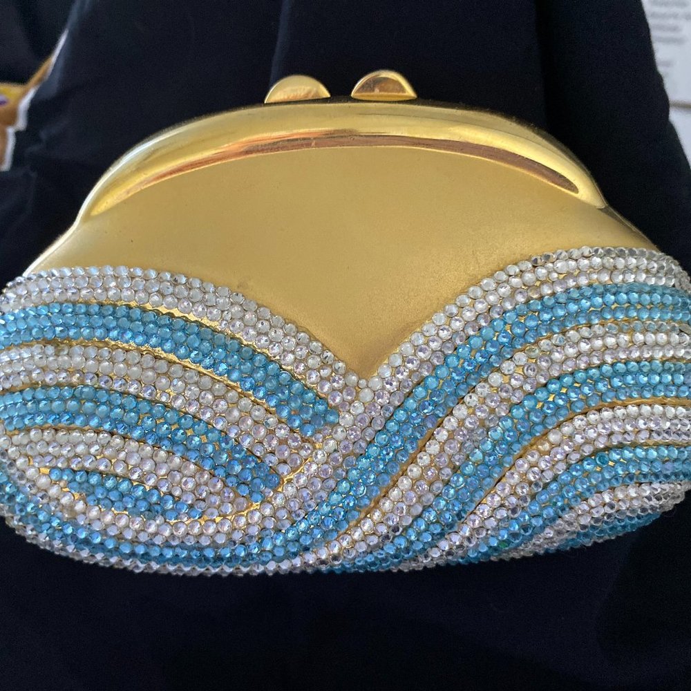 Hand designed with Swarovski crystals, hard sided evening clutch.